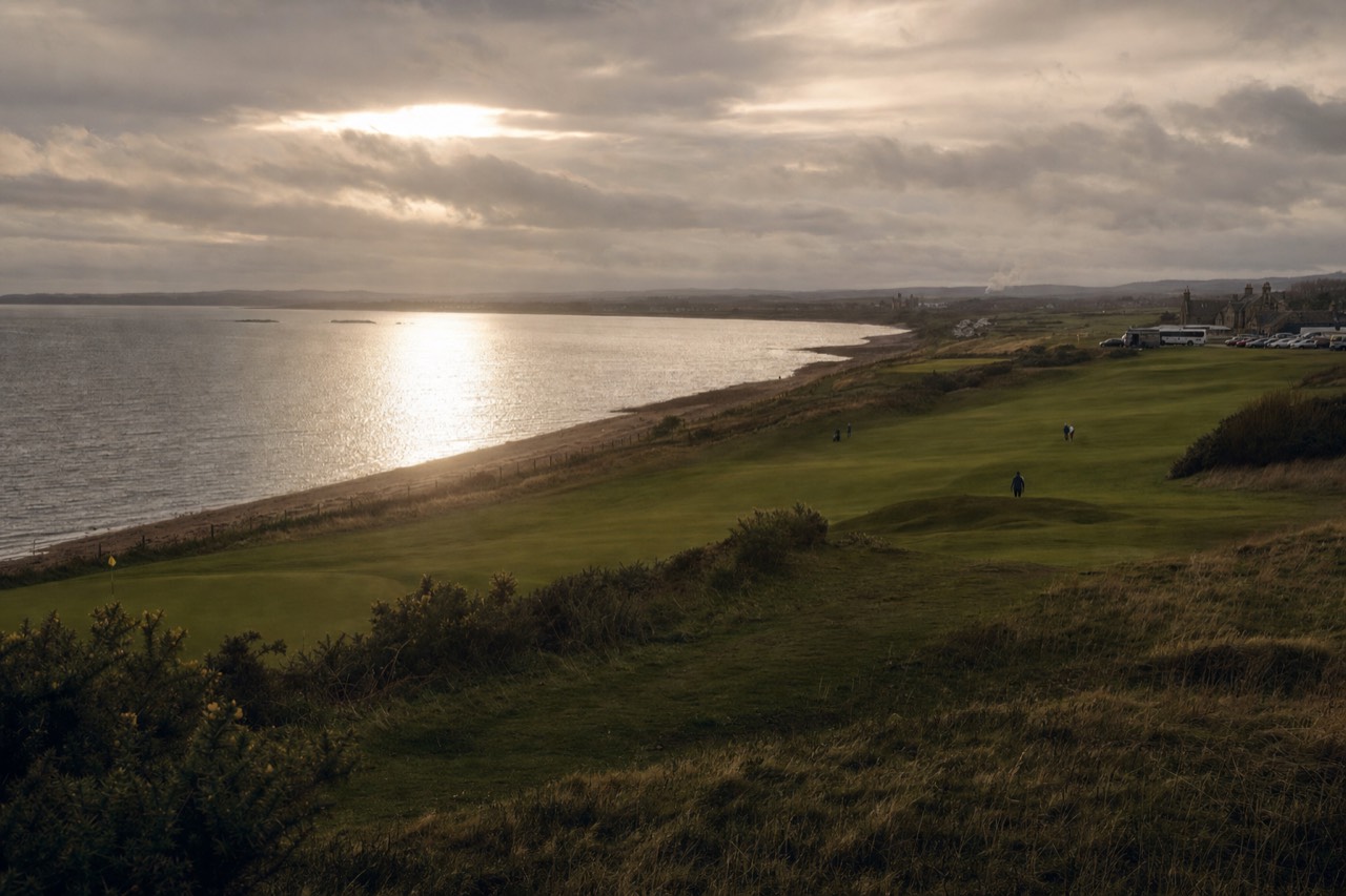 Coastal links fairway on the Fife coast near St Andrews under grey Scottish light.