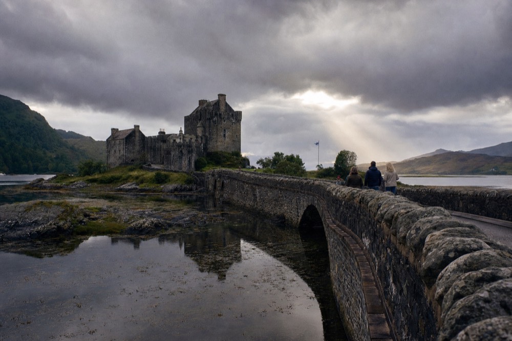Eilean Donan Castle on Loch Duich in the Scottish Highlands, reached by its stone footbridge